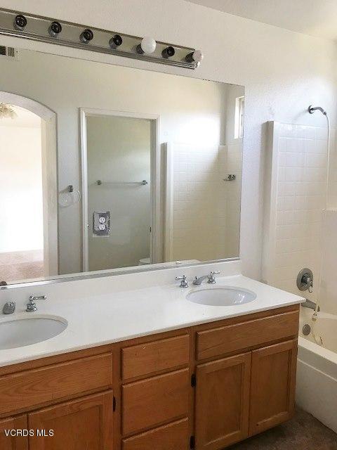 1027 Corte Primavera Oxnard, CA 93030 - Photo 12 of 17 a bathroom with a sink and a mirror