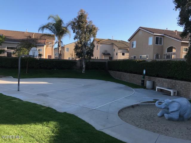 1027 Corte Primavera Oxnard, CA 93030 - Photo 17 of 17 a front view of a house with a garden