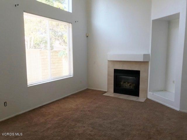 1027 Corte Primavera Oxnard, CA 93030 - Photo 3 of 17 an empty room with a fireplace