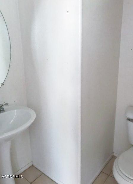 1027 Corte Primavera Oxnard, CA 93030 - Photo 7 of 17 a bathroom with a sink and a toilet