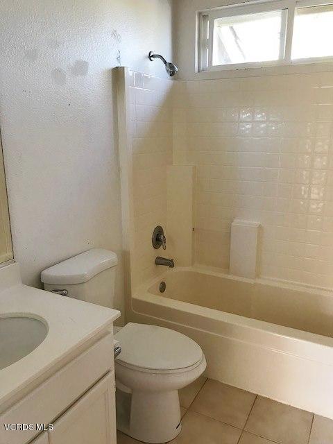 1027 Corte Primavera Oxnard, CA 93030 - Photo 9 of 17 a bathroom with a toilet and a bathtub