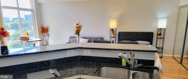 a kitchen with a sink and cabinets