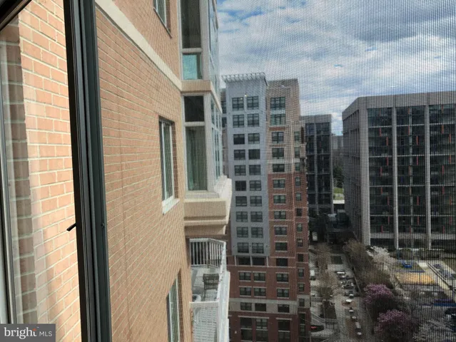 a view of a door with brick walls