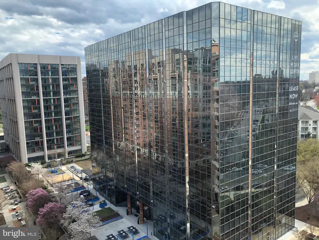 a view of a balcony with brick walls