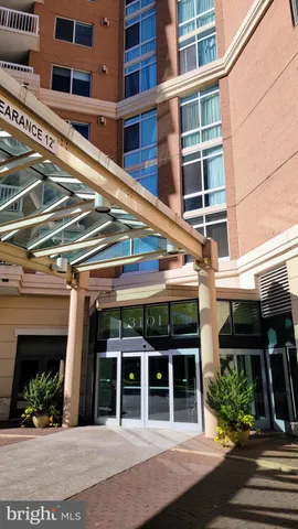 front view of building with a garden