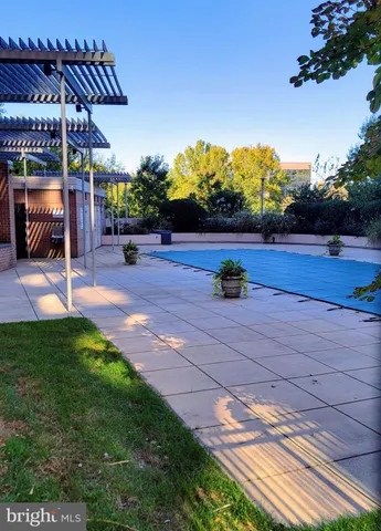 a view of a backyard with sitting area