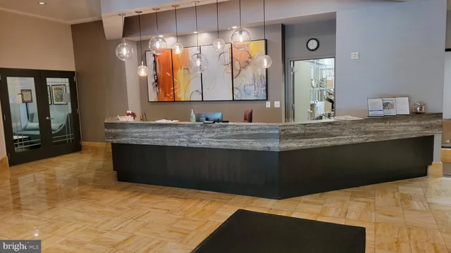 a bathroom with a sink vanity and mirror