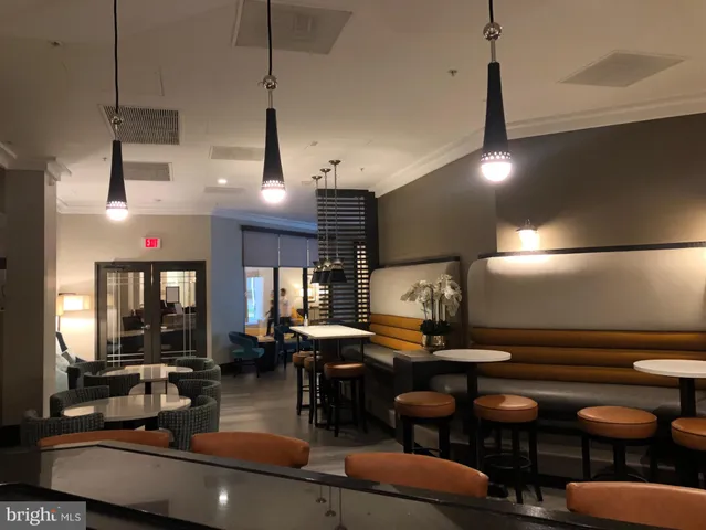 a room with lots of chairs and mirrors