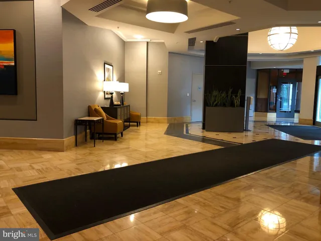 a view of kitchen with furniture and wooden floor