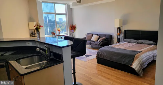 a bedroom with a bed and a window