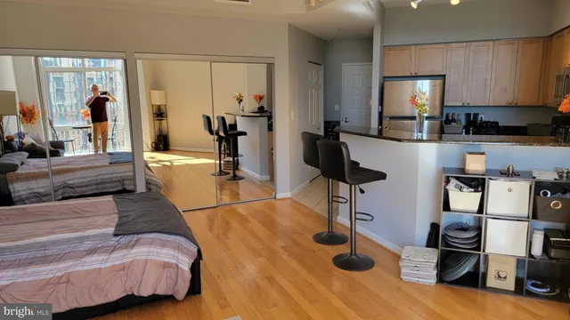 a view of living room with furniture and floor to ceiling window