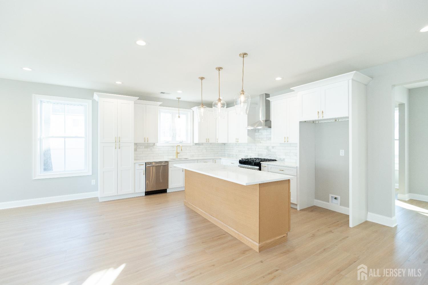 24 Parkerson Road Edison, NJ 08817 - Photo 16 of 56 a kitchen with a stove a sink and a refrigerator