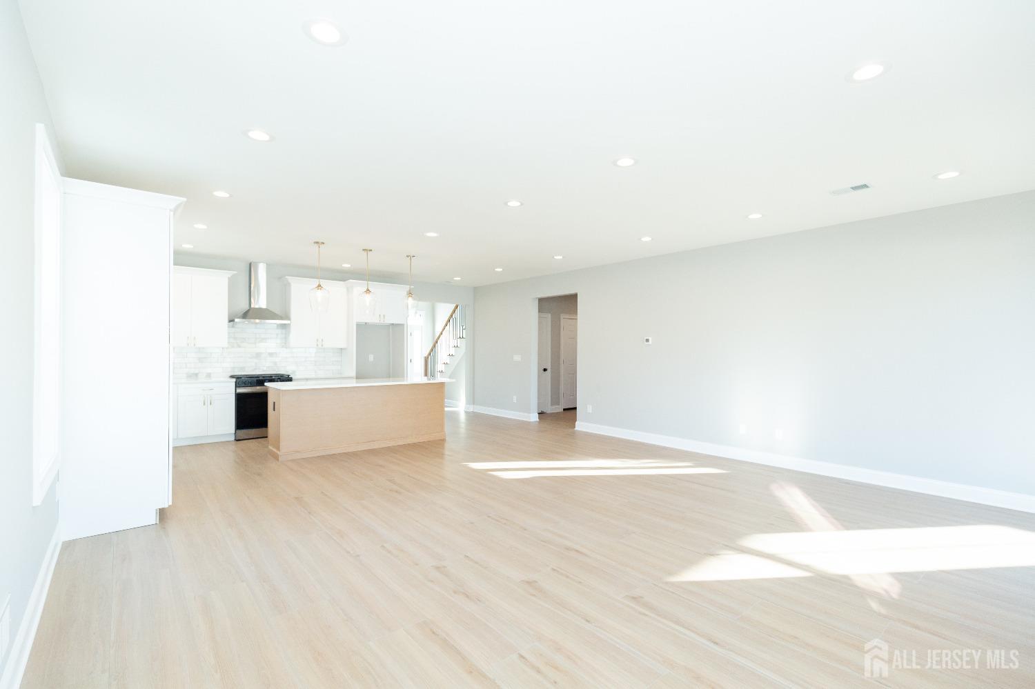 24 Parkerson Road Edison, NJ 08817 - Photo 18 of 56 a view of a kitchen with kitchen island and wooden floor
