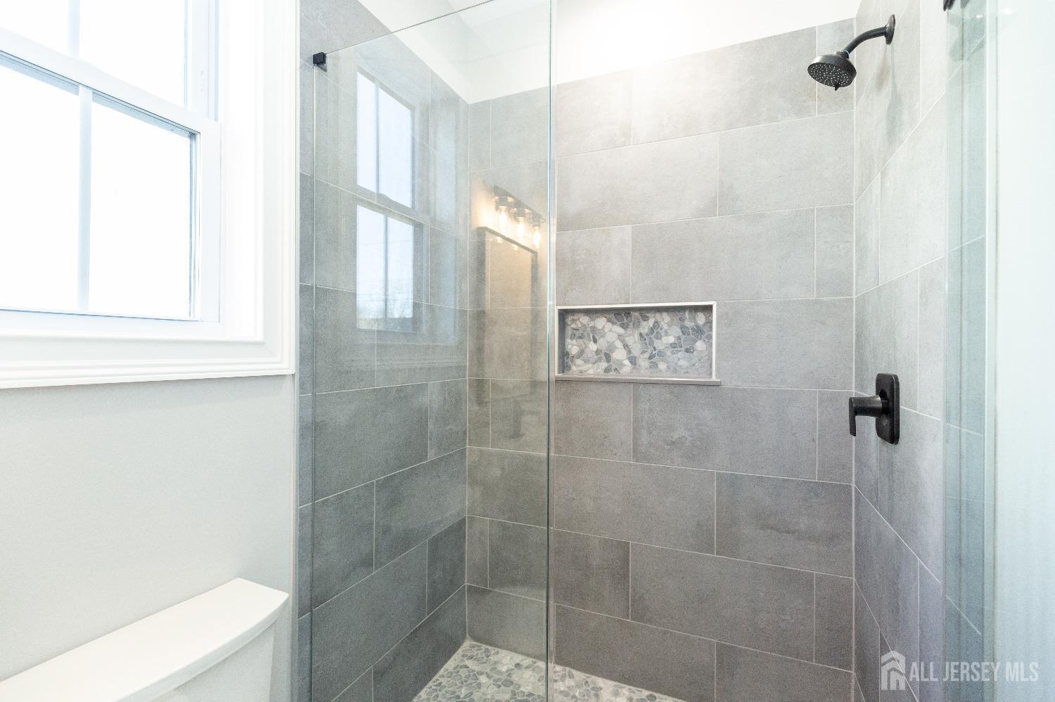 24 Parkerson Road Edison, NJ 08817 - Photo 23 of 56 a bathroom with a shower