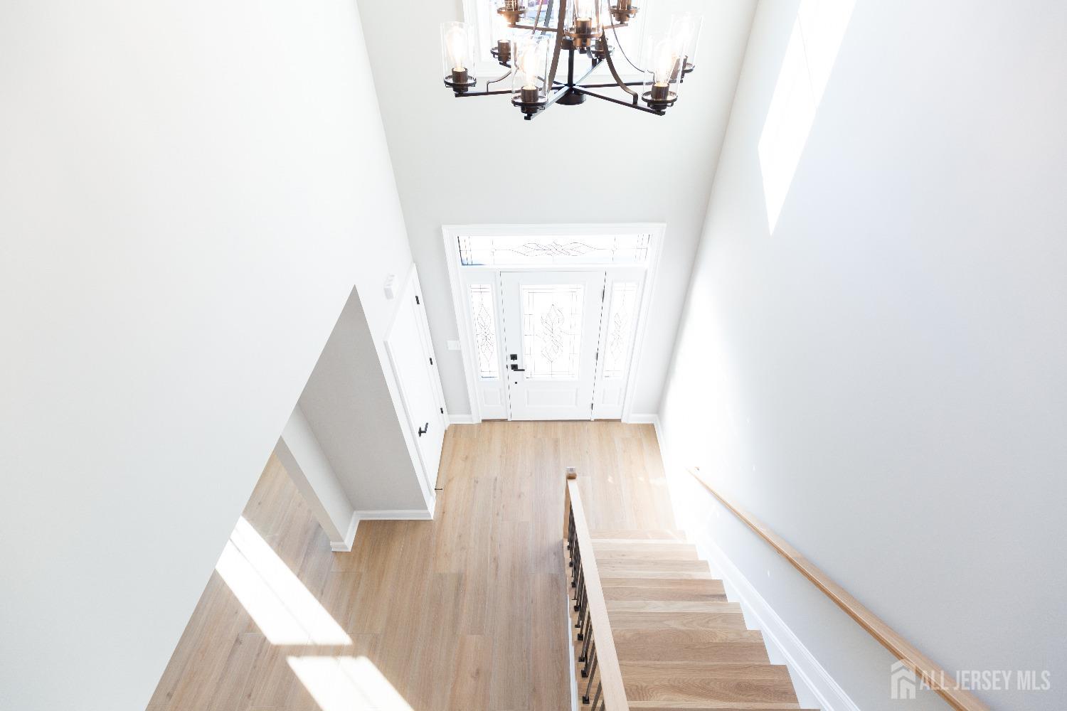 24 Parkerson Road Edison, NJ 08817 - Photo 25 of 56 a view of a hallway with wooden floor and staircase