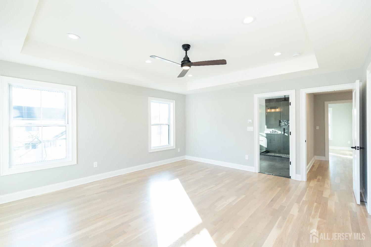 24 Parkerson Road Edison, NJ 08817 - Photo 30 of 56 wooden floor in an empty room with a window