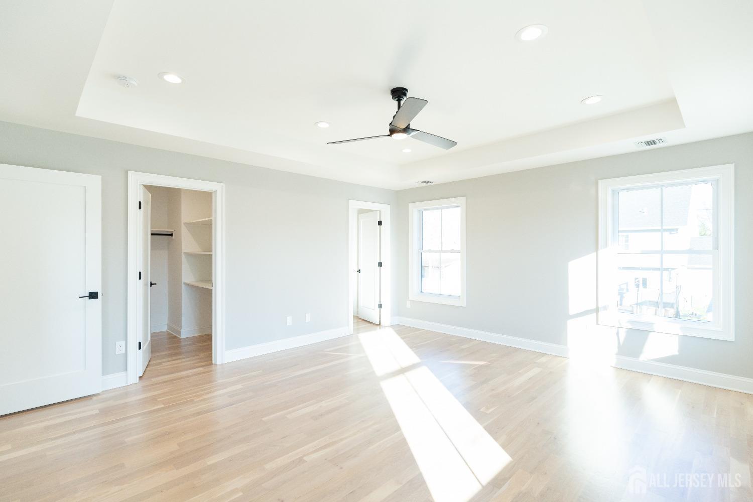 24 Parkerson Road Edison, NJ 08817 - Photo 32 of 56 a view of an empty room with a window and wooden floor