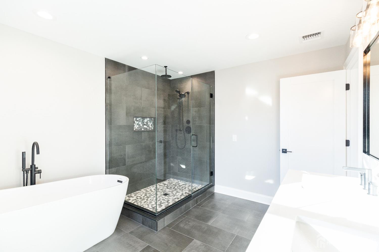 24 Parkerson Road Edison, NJ 08817 - Photo 34 of 56 a bathroom with a tub shower and sink