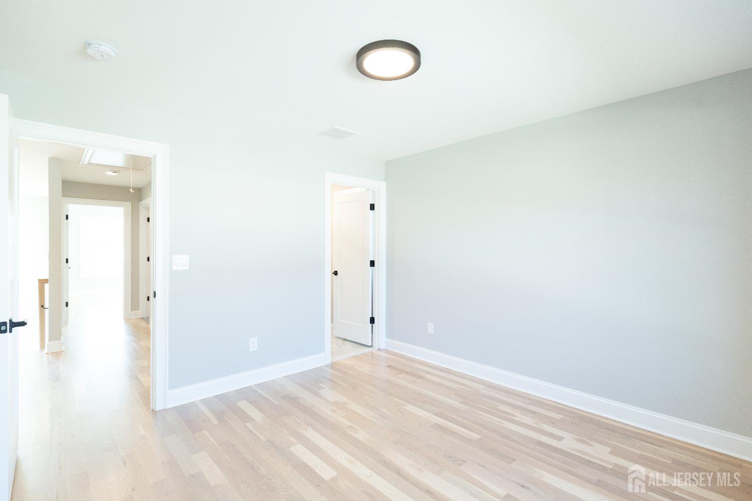 24 Parkerson Road Edison, NJ 08817 - Photo 42 of 56 a view of a room with wooden floor and window
