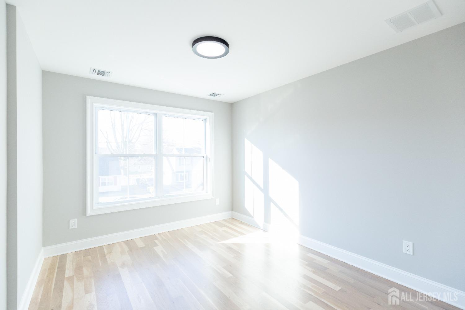 24 Parkerson Road Edison, NJ 08817 - Photo 48 of 56 a view of an empty room with a window