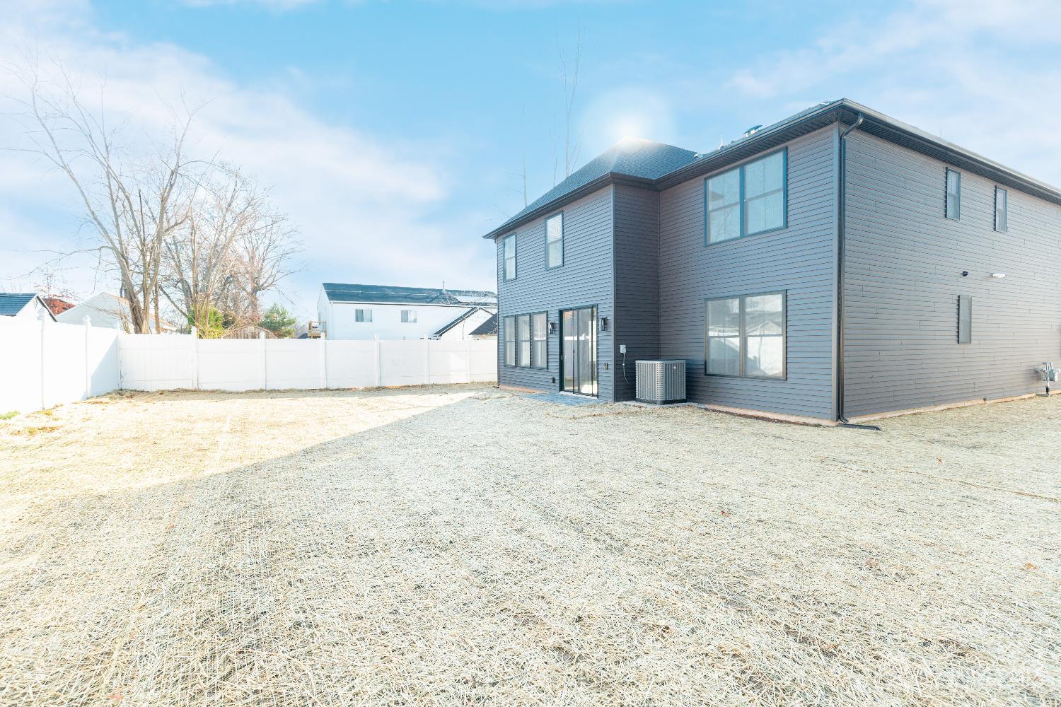 24 Parkerson Road Edison, NJ 08817 - Photo 55 of 56 a front view of a house with a yard