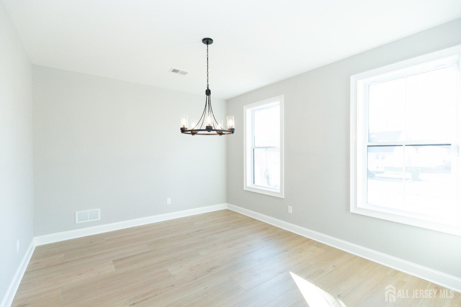24 Parkerson Road Edison, NJ 08817 - Photo 8 of 56 a view of empty room with windows
