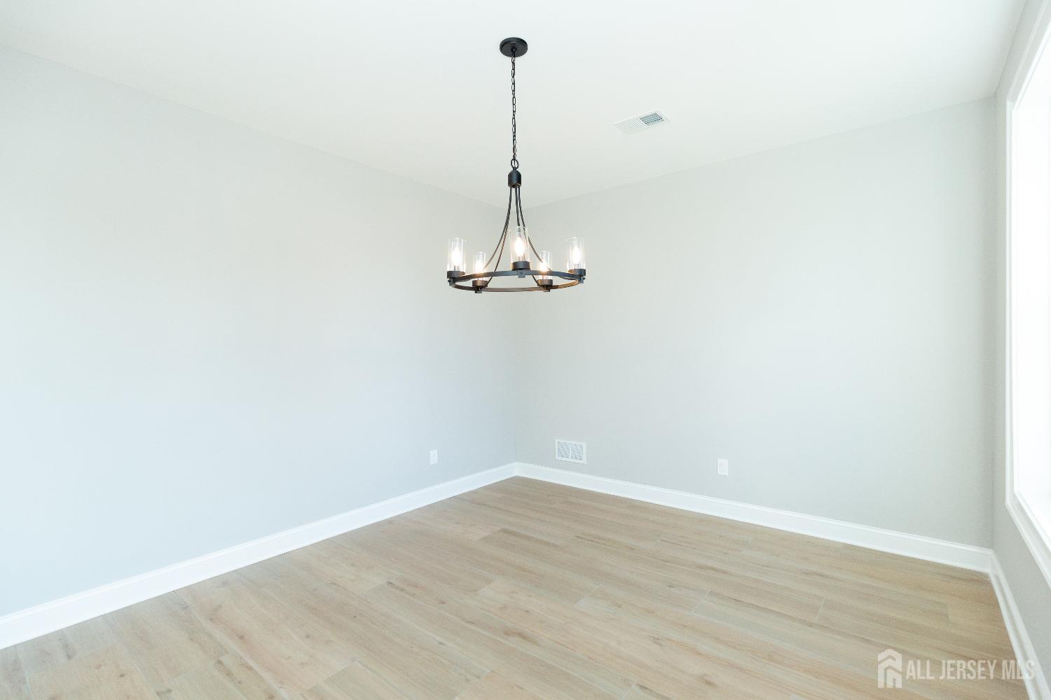 24 Parkerson Road Edison, NJ 08817 - Photo 9 of 56 a view of a room with wooden floor and a ceiling fan