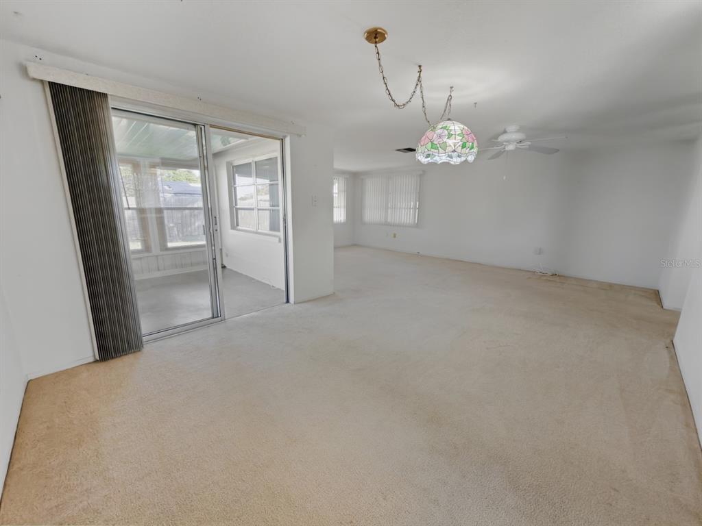 7903 Valmy Lane Port Richey, FL 34668 - Photo 14 of 40 a view of an empty room with a window