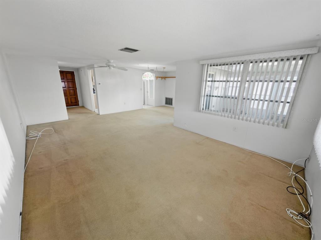 7903 Valmy Lane Port Richey, FL 34668 - Photo 18 of 40 a view of an empty room with a window