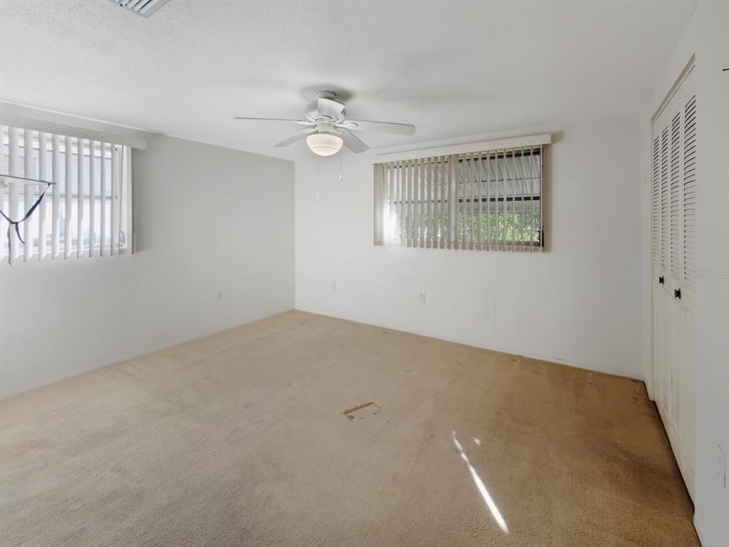 7903 Valmy Lane Port Richey, FL 34668 - Photo 19 of 40 an empty room with windows