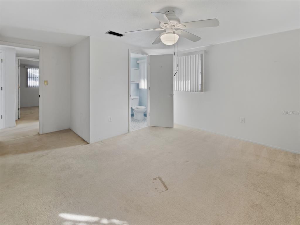 7903 Valmy Lane Port Richey, FL 34668 - Photo 20 of 40 wooden floor in an empty room