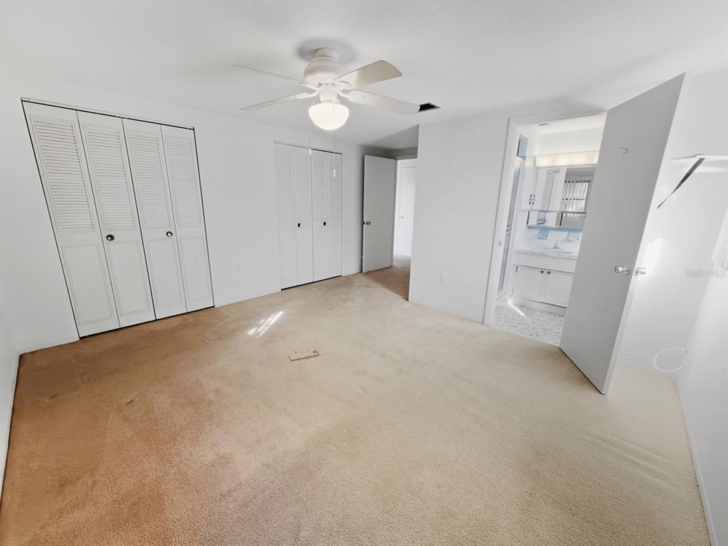 7903 Valmy Lane Port Richey, FL 34668 - Photo 21 of 40 a view of an empty room with wooden floor