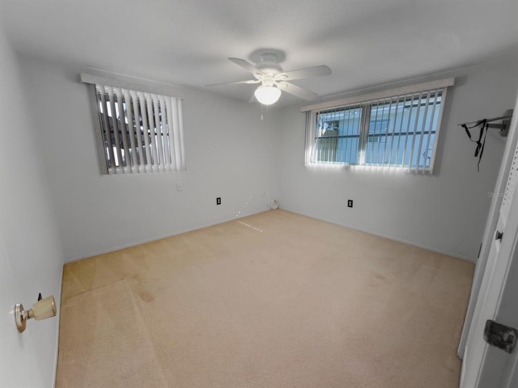 7903 Valmy Lane Port Richey, FL 34668 - Photo 24 of 40 a view of an empty room with a window