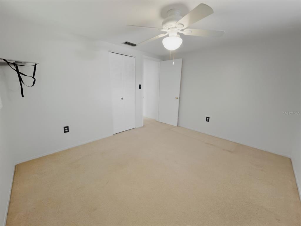 7903 Valmy Lane Port Richey, FL 34668 - Photo 25 of 40 a view of a room with a fan