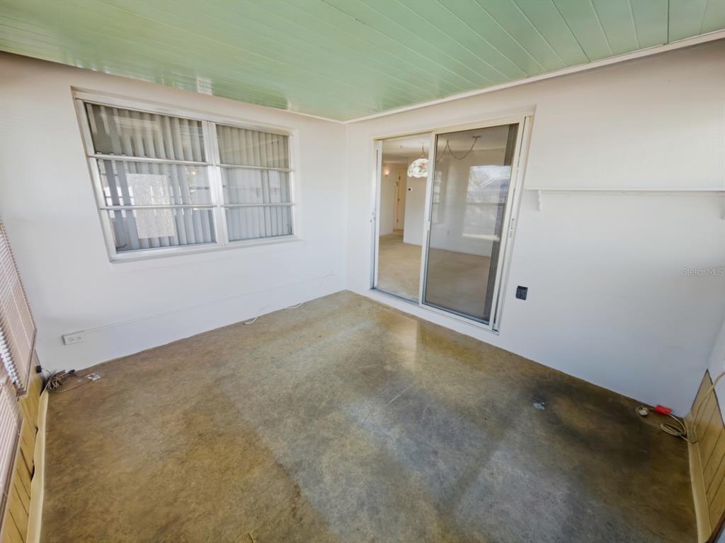 7903 Valmy Lane Port Richey, FL 34668 - Photo 29 of 40 an empty room with windows
