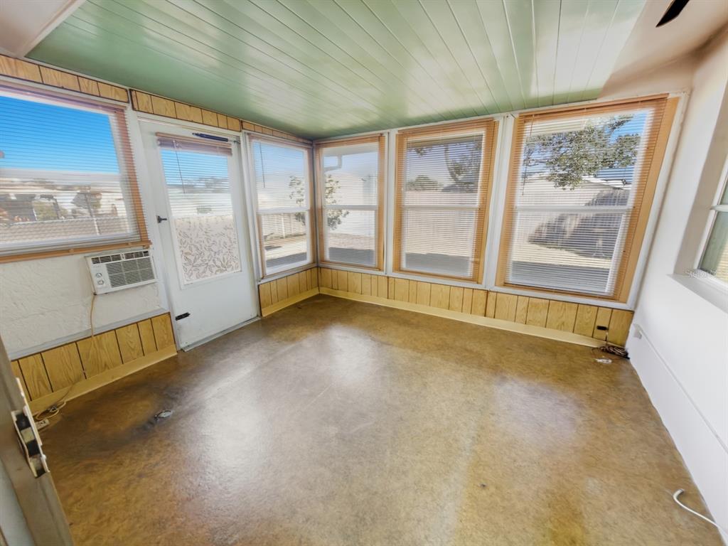 7903 Valmy Lane Port Richey, FL 34668 - Photo 30 of 40 a view of an empty room with a window