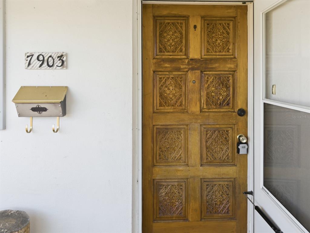 7903 Valmy Lane Port Richey, FL 34668 - Photo 6 of 40 a door with a door