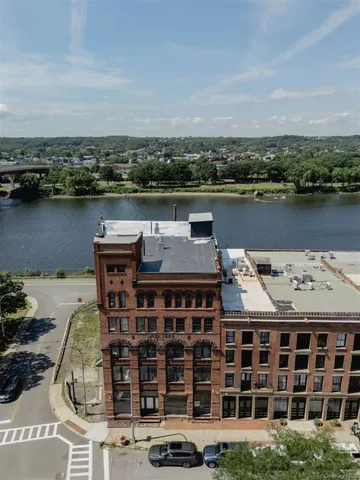 an aerial view of a house with a lake view
