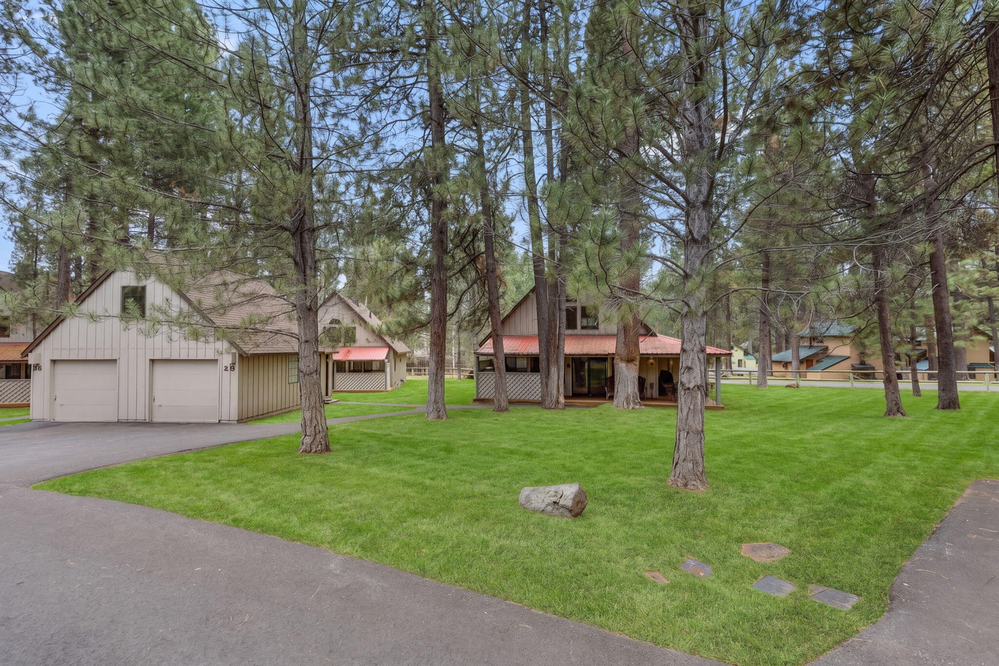 57505 Circle 4 Cabin Road, Unit 29 Sunriver, OR 97707 - Photo 2 of 35 front view of a house and a yard