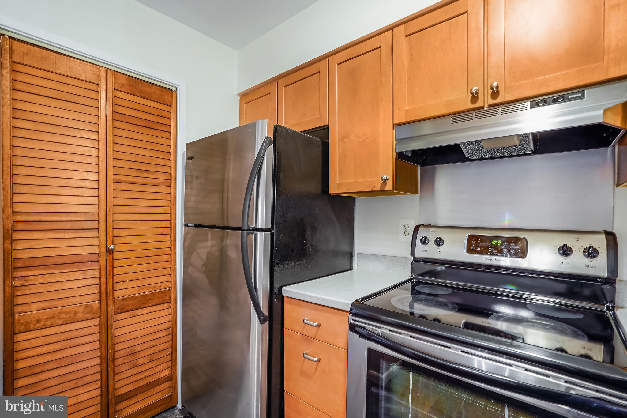 2023 Headlands Circle Reston, VA 20191 - Photo 16 of 44 Laundry situated next to kitchen thru bifold door