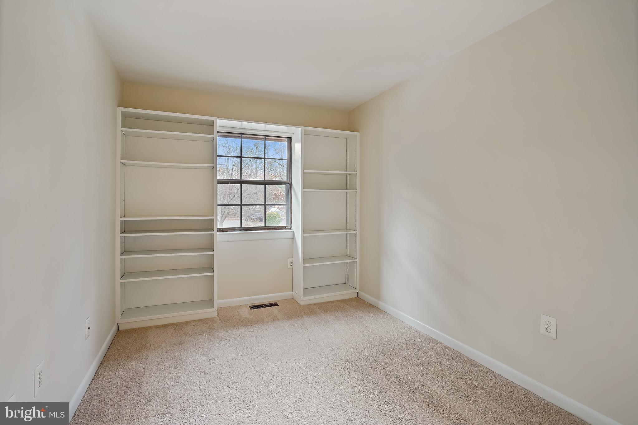 2023 Headlands Circle Reston, VA 20191 - Photo 22 of 44 2nd bedroom has built-in shelves...very nice touch