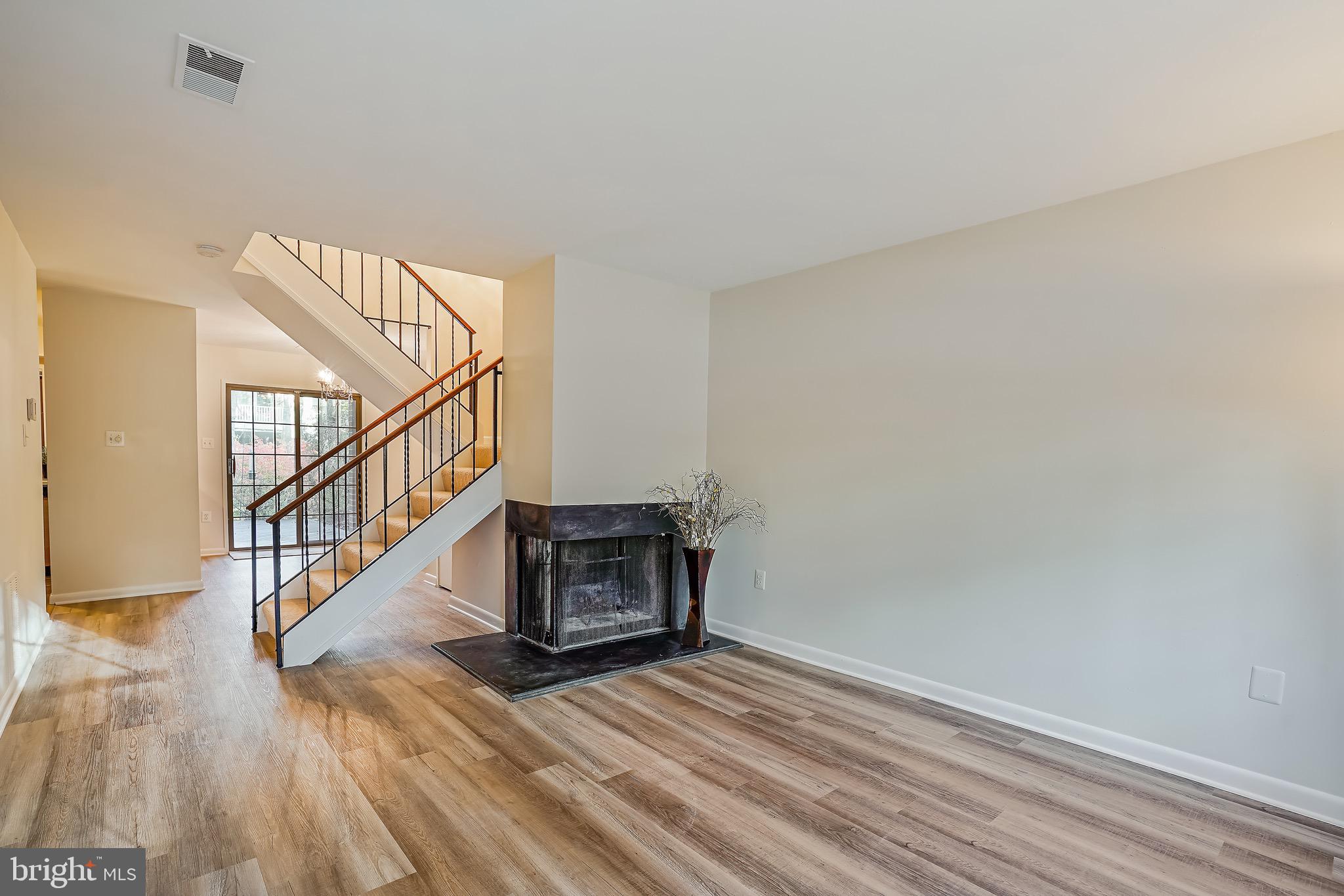 2023 Headlands Circle Reston, VA 20191 - Photo 4 of 44 Open concept with 2-sided fireplace