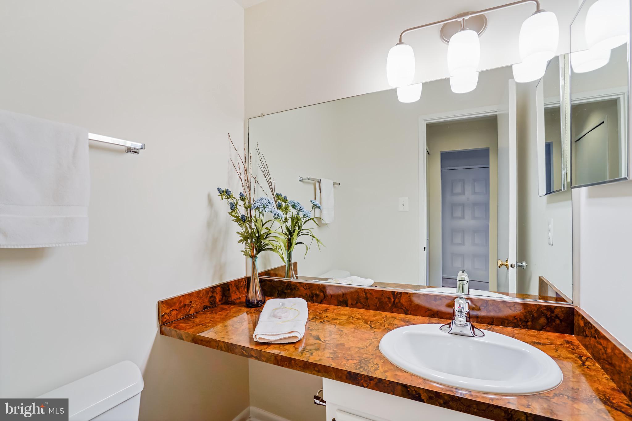 2023 Headlands Circle Reston, VA 20191 - Photo 8 of 44 Powder room conveniently located on main level