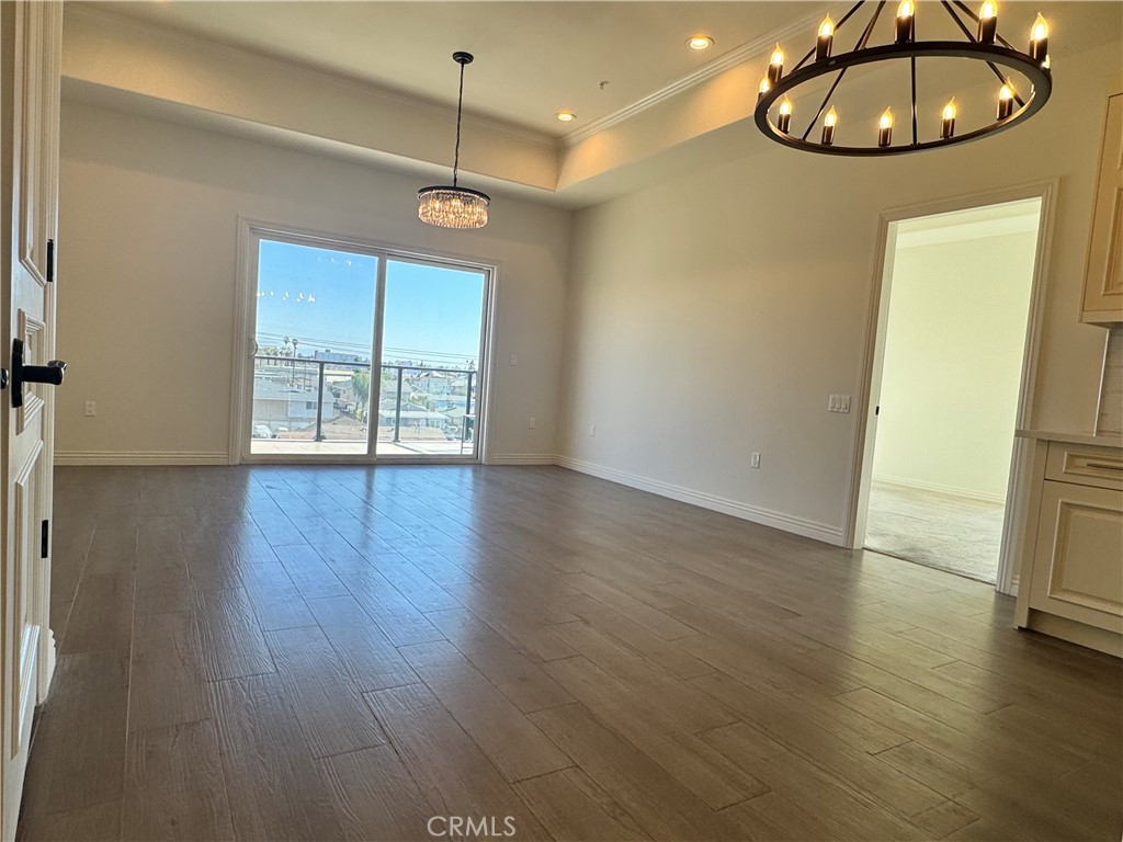 1598 Long Beach Long Beach, CA 90813 - Photo 3 of 6 a view of an empty room with wooden floor and window