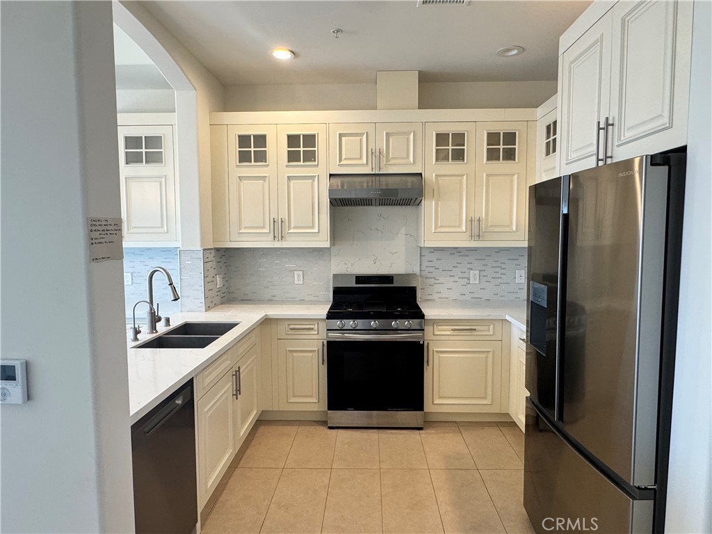 1598 Long Beach Long Beach, CA 90813 - Photo 4 of 6 a kitchen with a sink stove and refrigerator