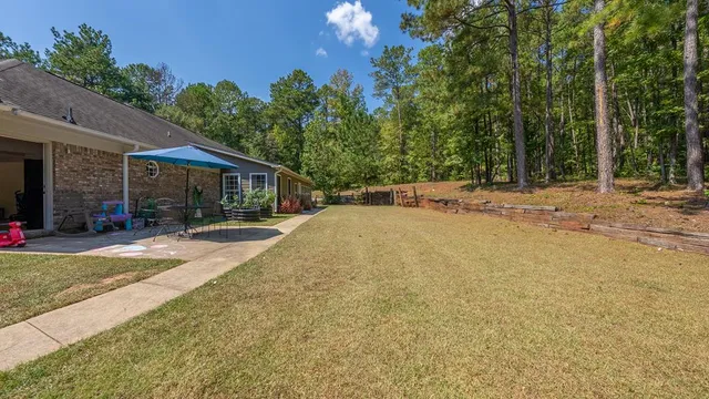 a view of a house with basketball court
