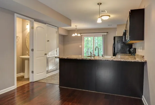 a view of a kitchen from the hallway