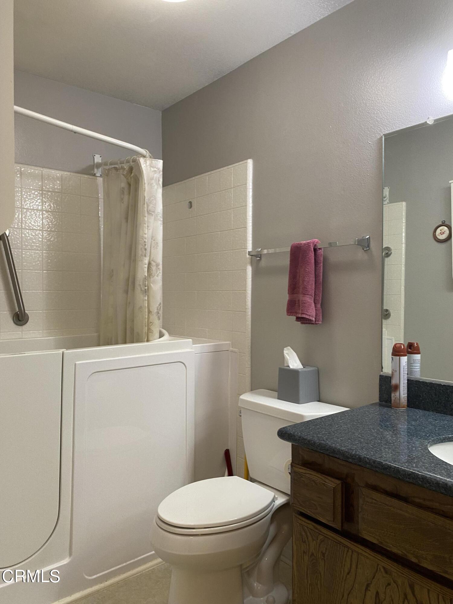 1341 Bottlebrush Place Oxnard, CA 93030 - Photo 16 of 25 a bathroom with a sink a toilet a shower and a mirror