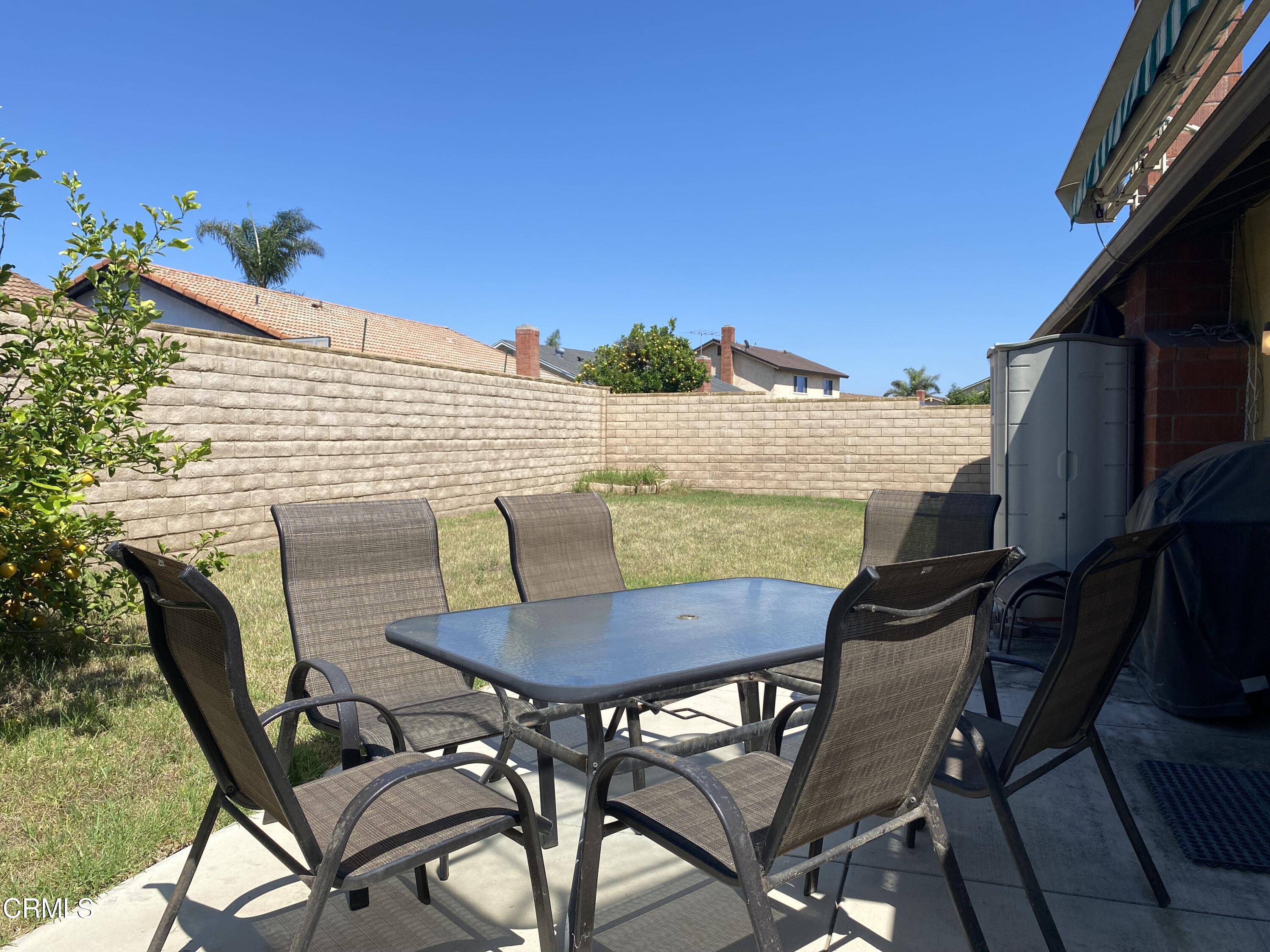 1341 Bottlebrush Place Oxnard, CA 93030 - Photo 24 of 25 a view of a patio with table and chairs and potted plants