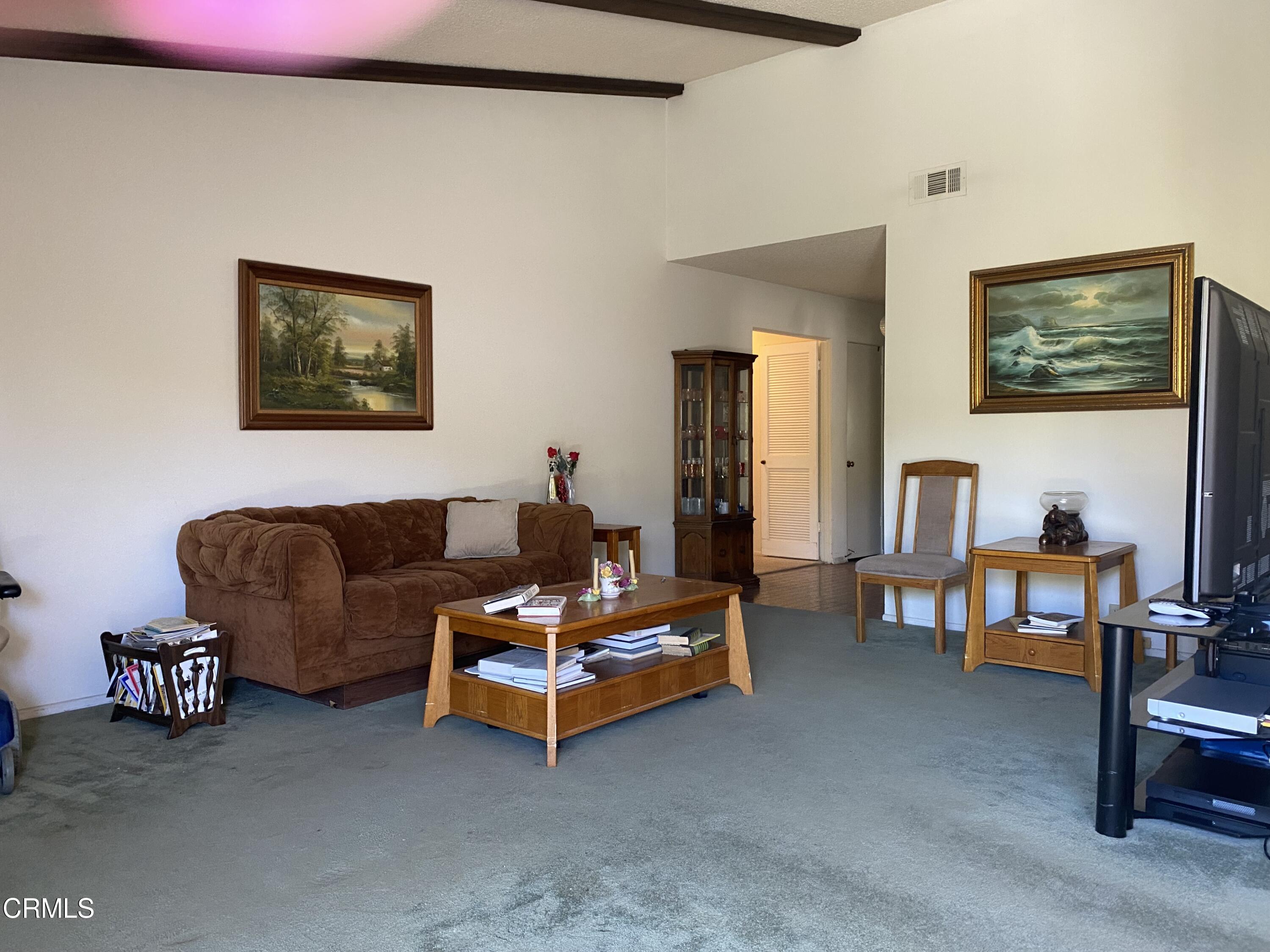 1341 Bottlebrush Place Oxnard, CA 93030 - Photo 3 of 25 a living room with furniture and a table